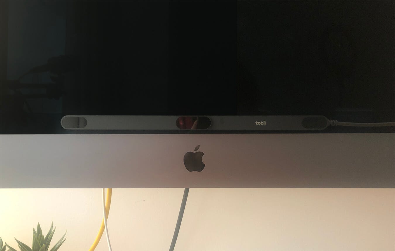 imac computer with a slim bar stuck on the front